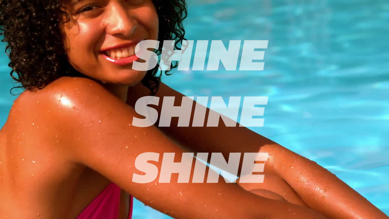 By pool, woman in pink swimsuit with SHINE text, animation overlaying scene