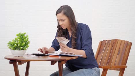 Middle-class-Indian-woman-counting-money