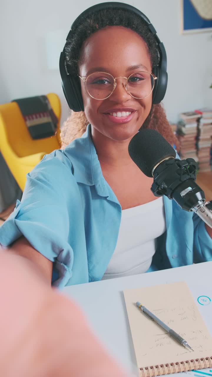 Engaging podcast discussion with a cheerful host in a cozy studio