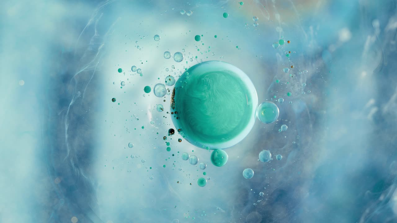 다채로운 실리콘 오일 유체 예술 추상 아크릴 액체 거품 은하계가 흐르는 효과로 소용돌이 치고 있습니다.