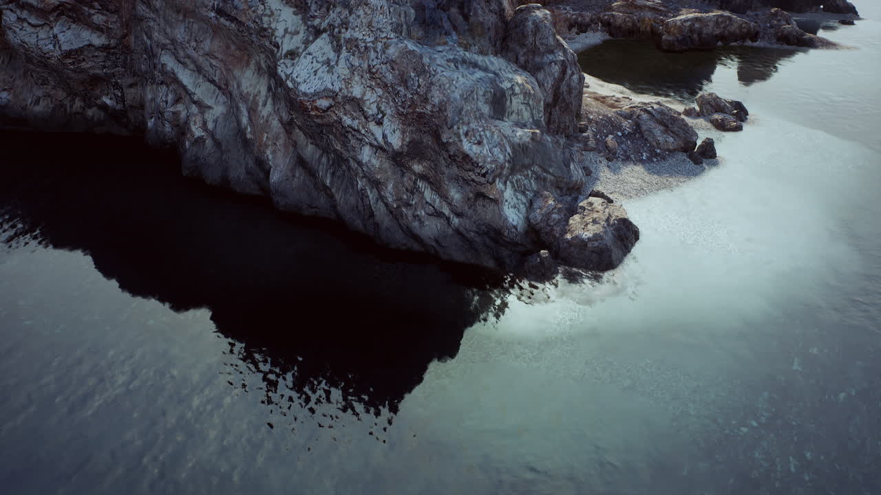 Aerial view of a rocky cliff and ocean