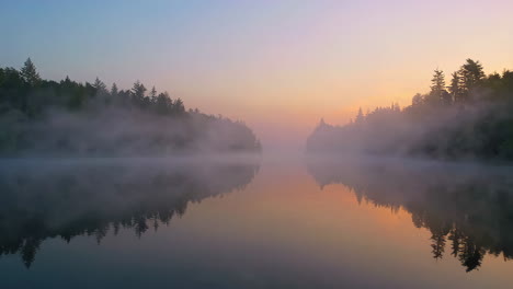 misty sunrise over a lake