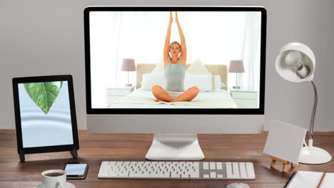 animation of a computer monitor showing caucasian woman practising yoga on the screen.