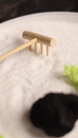 zen garden with rake and stones