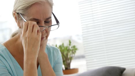 tired woman touching her neck