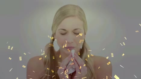 Animation-of-golden-confetti-falling-over-caucasian-sick-woman-with-tissue-blowing-her-nose