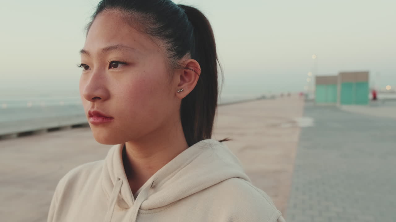 Portrait of a young woman on a pier
