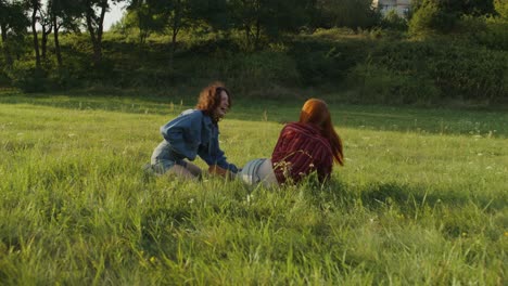 two women playing in a field