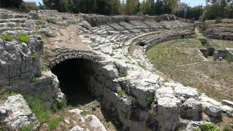 roman amphitheatre of syracuse (siracusa), ruins of ancient monument, sicily, italy. footage 4k