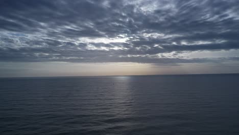 south china sea morning sunrise aerial view with dramatic sky and reflection