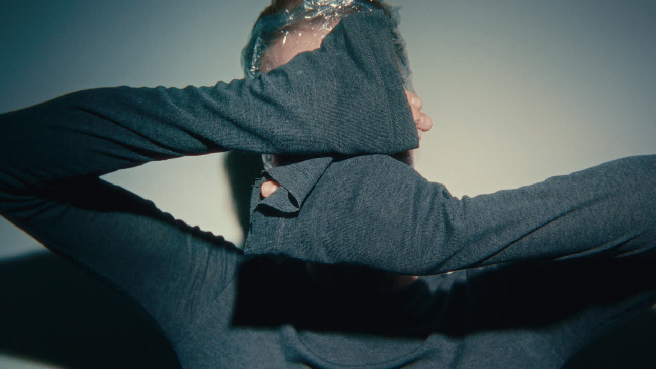 Woman with Plastic Wrap on Face