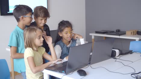 Naughty-children-sitting-and-standing-at-desk