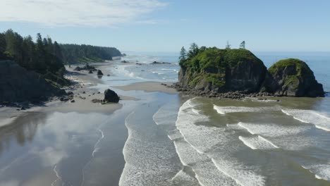 Drone-Flies-Along-Ruby-Beach-Coast-on-Summer-Afternoon,-Olympic-National-Park,-Blue-Sky