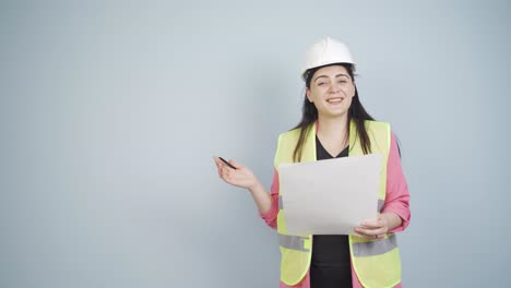 engineer looking at camera in amazement and making a presentation.