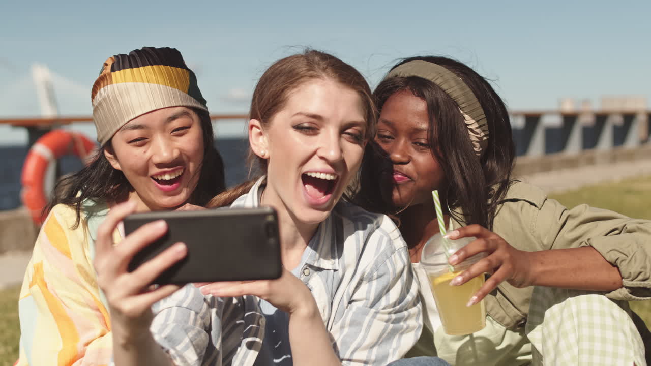 Multiethnic Women Video Chatting Outdoors