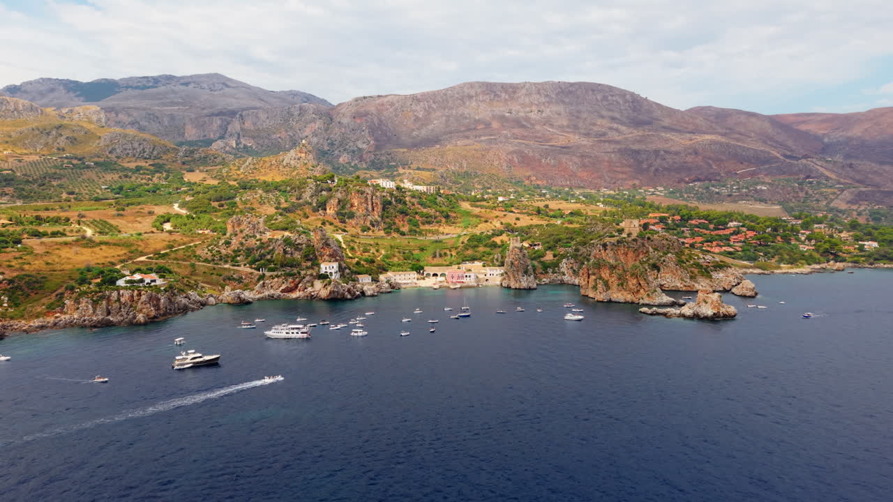 Panorama Of Scopello Coastal Village In Castellammare del Golfo, Trapani Province, Sicily, Southern Italy. Aerial Pullback Shot