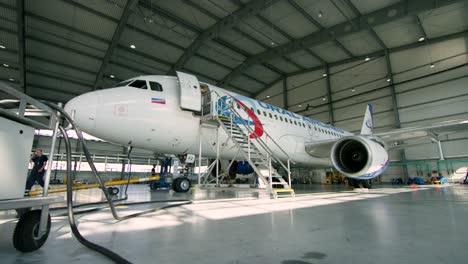 ural airlines airbus a320 in maintenance hangar