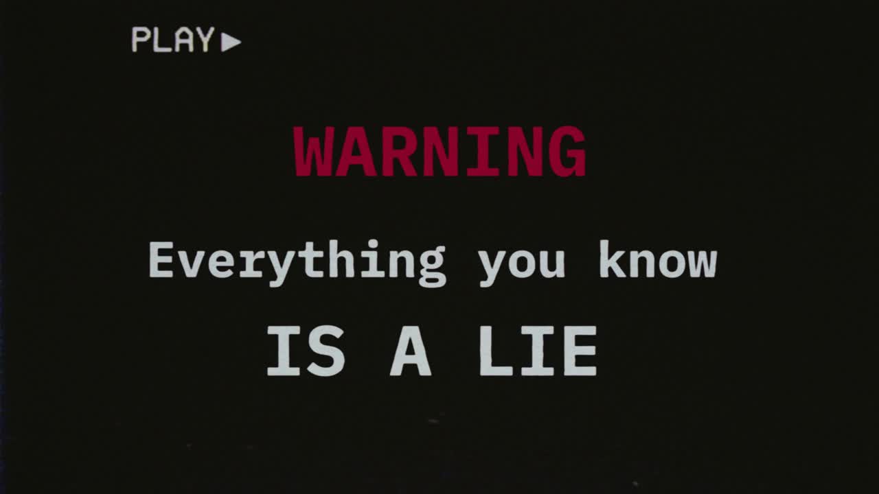 Reconstructed fake VHS tape capture contains a warning text message: everything you know is a lie