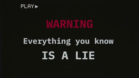 reconstructed fake vhs tape capture contains a warning text message: everything you know is a lie