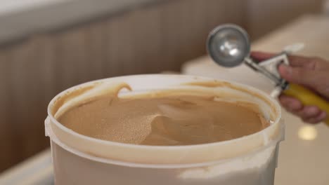 pouring chocolate ice cream, highlighting the simple pleasure of enjoying a classic and rich dessert