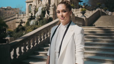 stylish young woman standing outdoors.