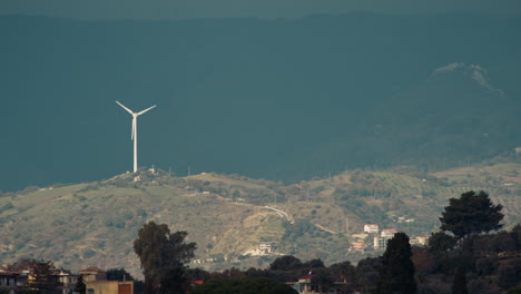 wind power plant distant on the mountains