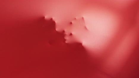 video of shapes of hands and head moving on red background