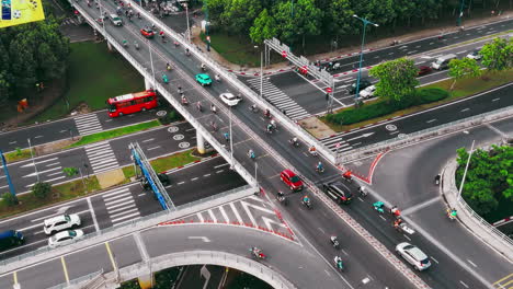 a dynamic aerial view of a bustling highway intersection, showcasing the constant flow of traffic