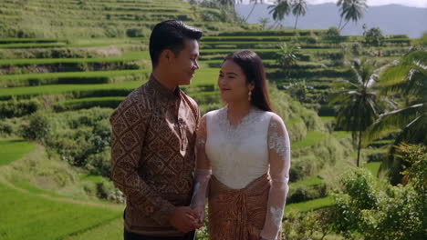 couple in traditional clothing at rice terraces in bali