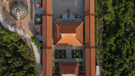 rising top down aerial view of traditional chinese temple in macau