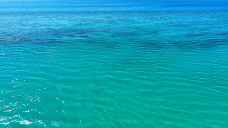 vibrant turquoise ocean water under a blue sky