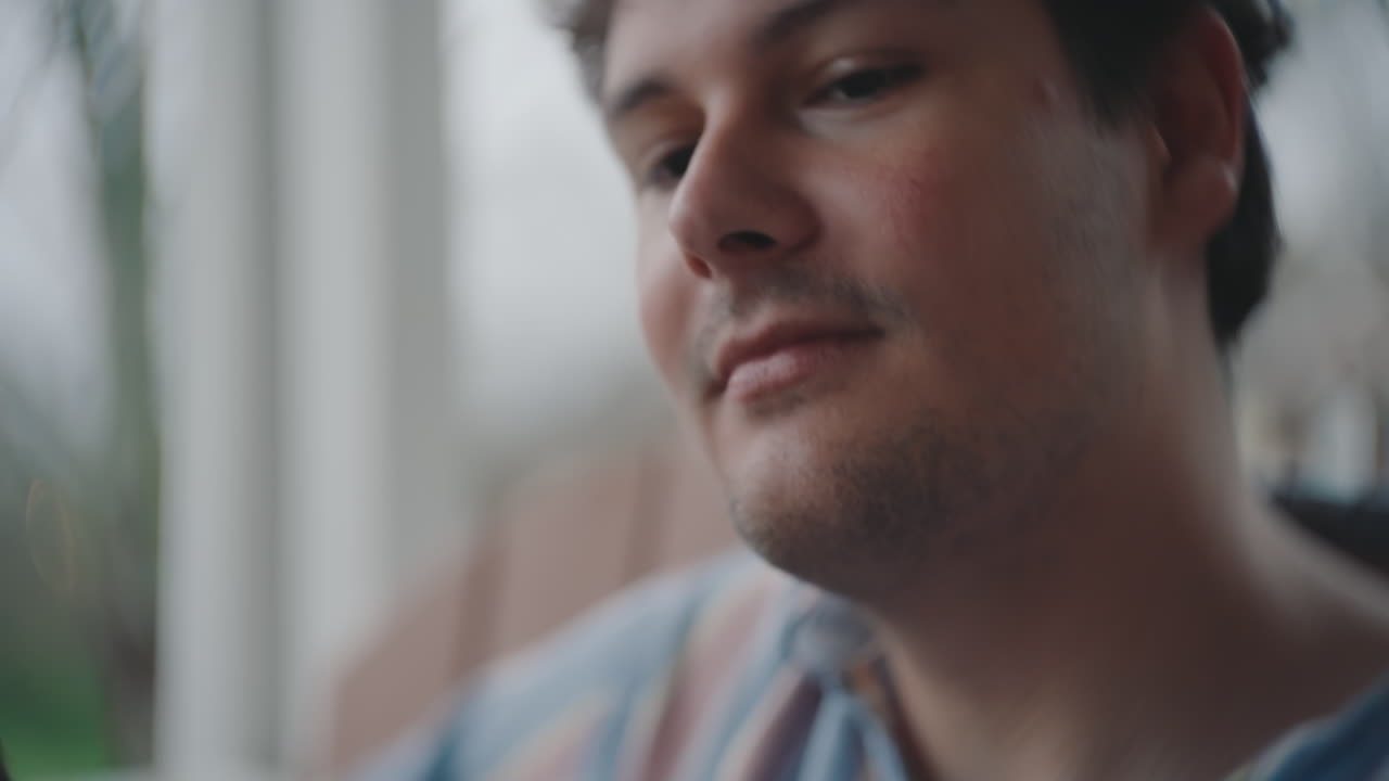Man playing guitar at home