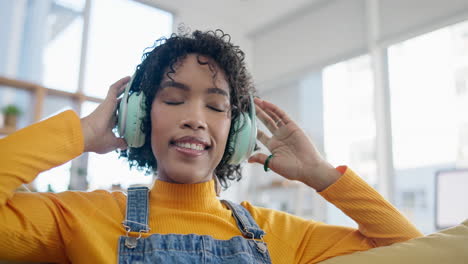 music, happy and dance with woman on sofa
