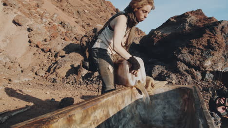 woman pouring water into old bath in post apocalyptic world