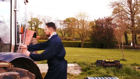 cattle farmer getting in the tractor