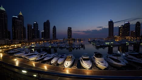 modern skyscrapers towering over a tranquil marina filled with luxurious yachts, reflecting the vibrant cityscape as the sun begins to rise over dubai