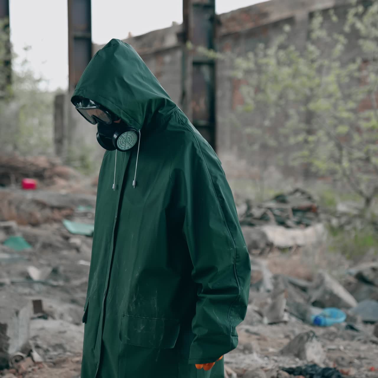 Man in special suit going out in abandoned creepy place. Apocalyptic pollution architecture