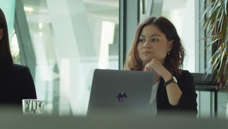 young woman at a lecture in a conference room