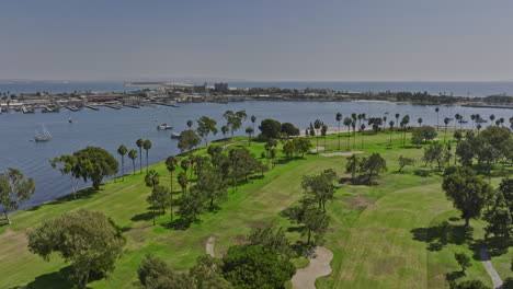 san diego california aerial v58 cinematic drone flyover coronado golf course overlooking at nab swimming pool on silver strand across glorietta bay in summer - shot with mavic 3 cine - september 2022