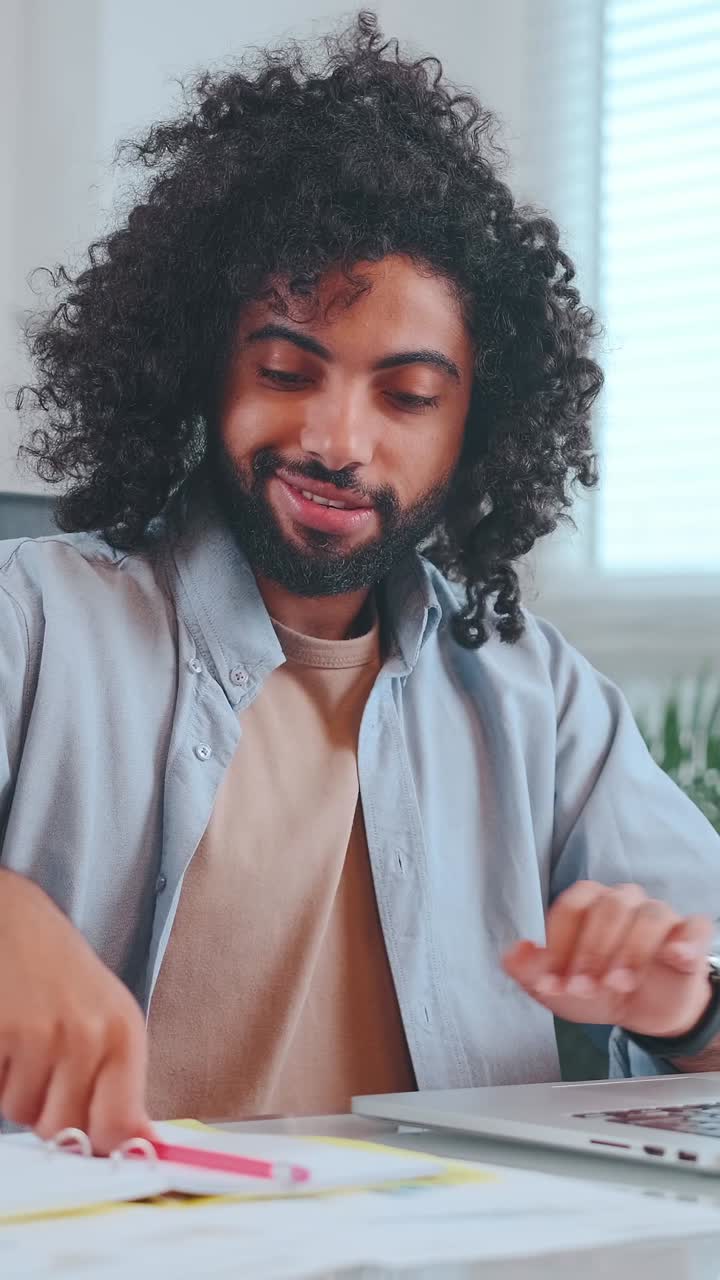Thoughtful man contemplating ideas while seated indoors on a sunny day