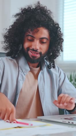 thoughtful man contemplating ideas while seated indoors on a sunny day