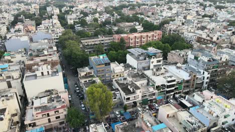 4k aerial shots of new delhi residential suburbs on a beautiful day gliding over rooftops, streets, parks and markets in india