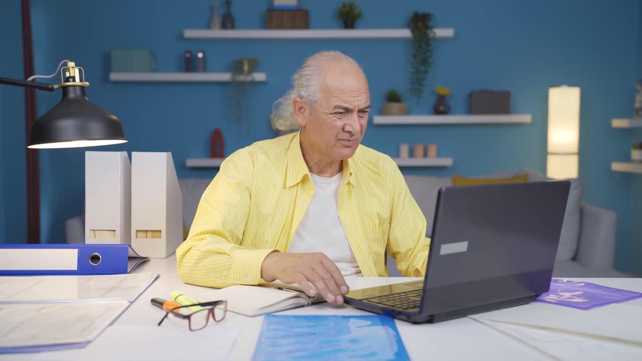 Home office worker old man has trouble focusing.