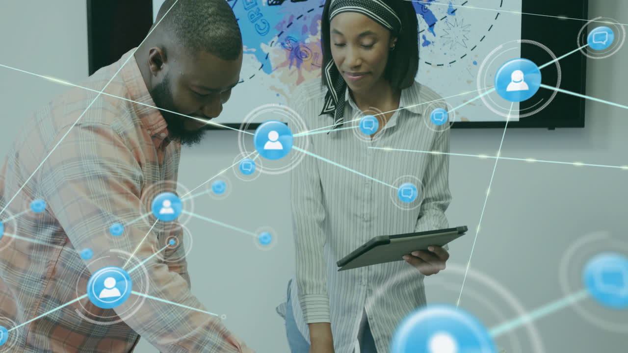 Animation of network of connections with people icons over diverse business people in office