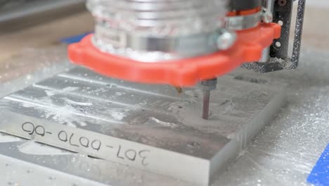 CNC-machine-engraving-a-block-of-aluminum