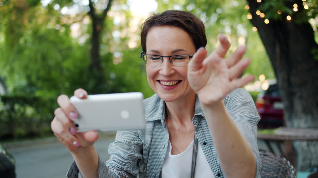 Woman taking a picture in a cafe