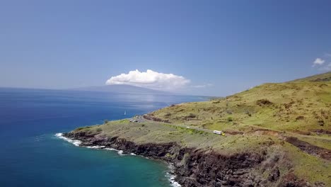 drone over hawaiian island coast line with cliffs