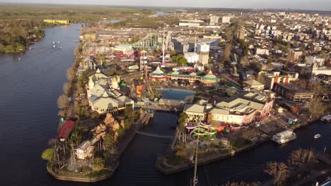 a dynamic aerial footage of the parque de la costa amusement park at the tigre area in buenos aires