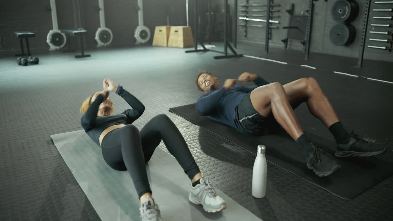 Couple working out in gym