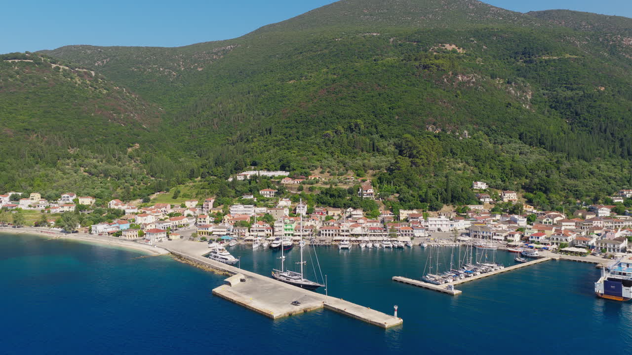 Aerial view of Sami port with luxury yachts and cruise ship anchored, Kefalonia island, Greece